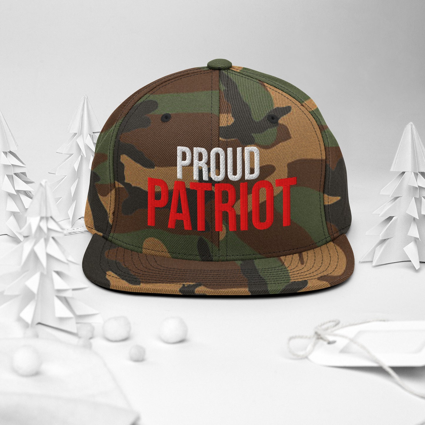 Camouflage cap with 'PROUD PATRIOT' text on a white background