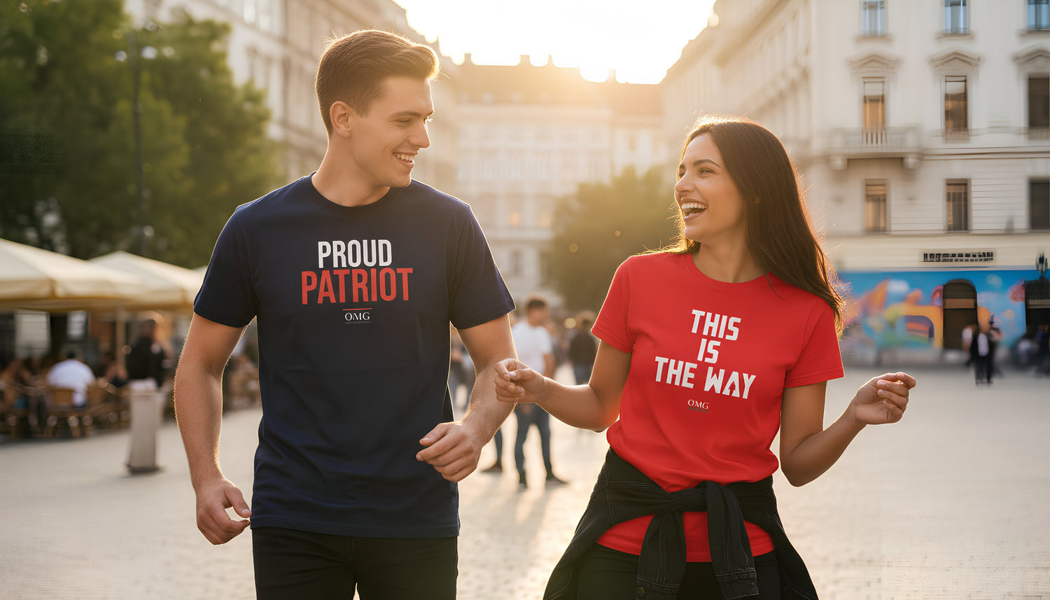 Two people walking hand in hand on a street, wearing t-shirts with text.