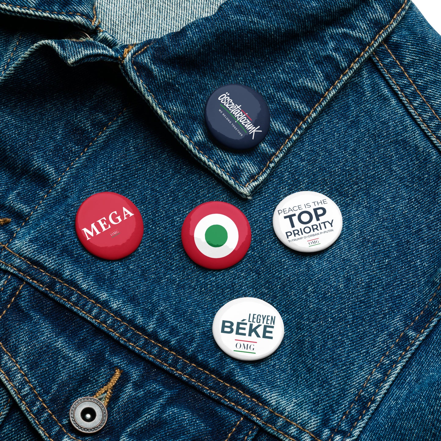 Buttons on a denim jacket with various text and designs.