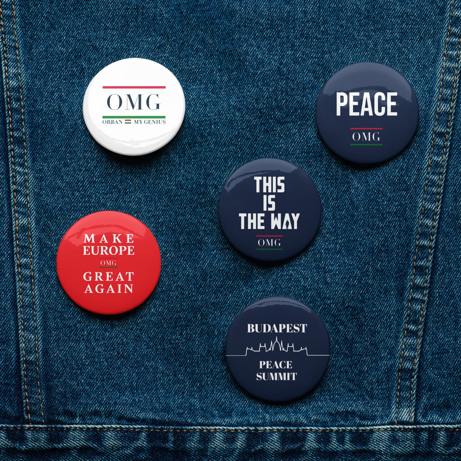Set of buttons with various designs on a denim background